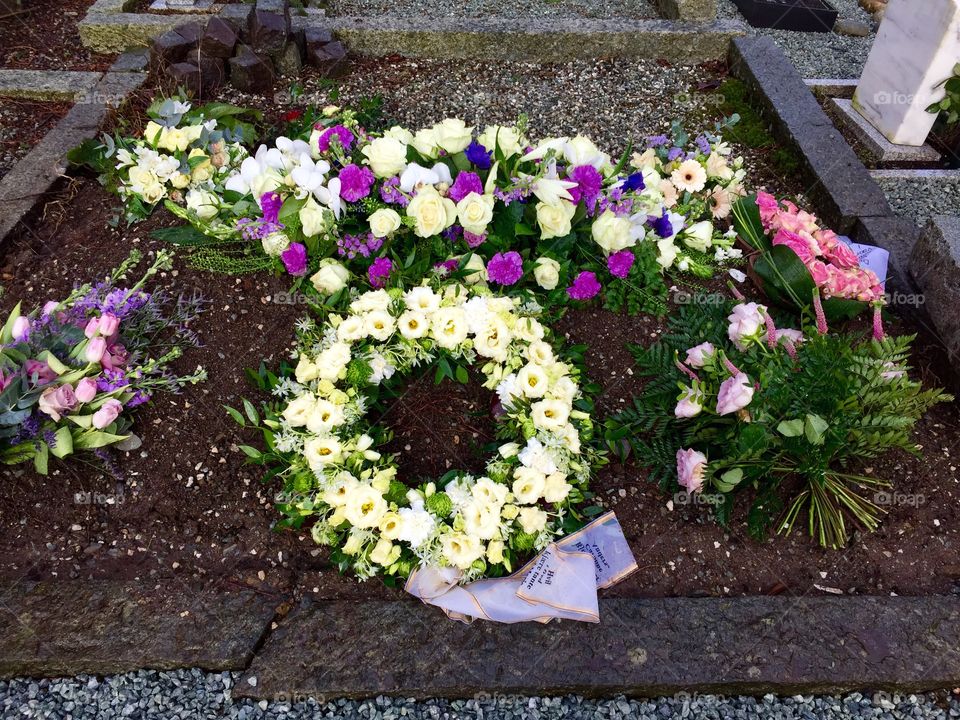 Grave. Flowers on a grave. 