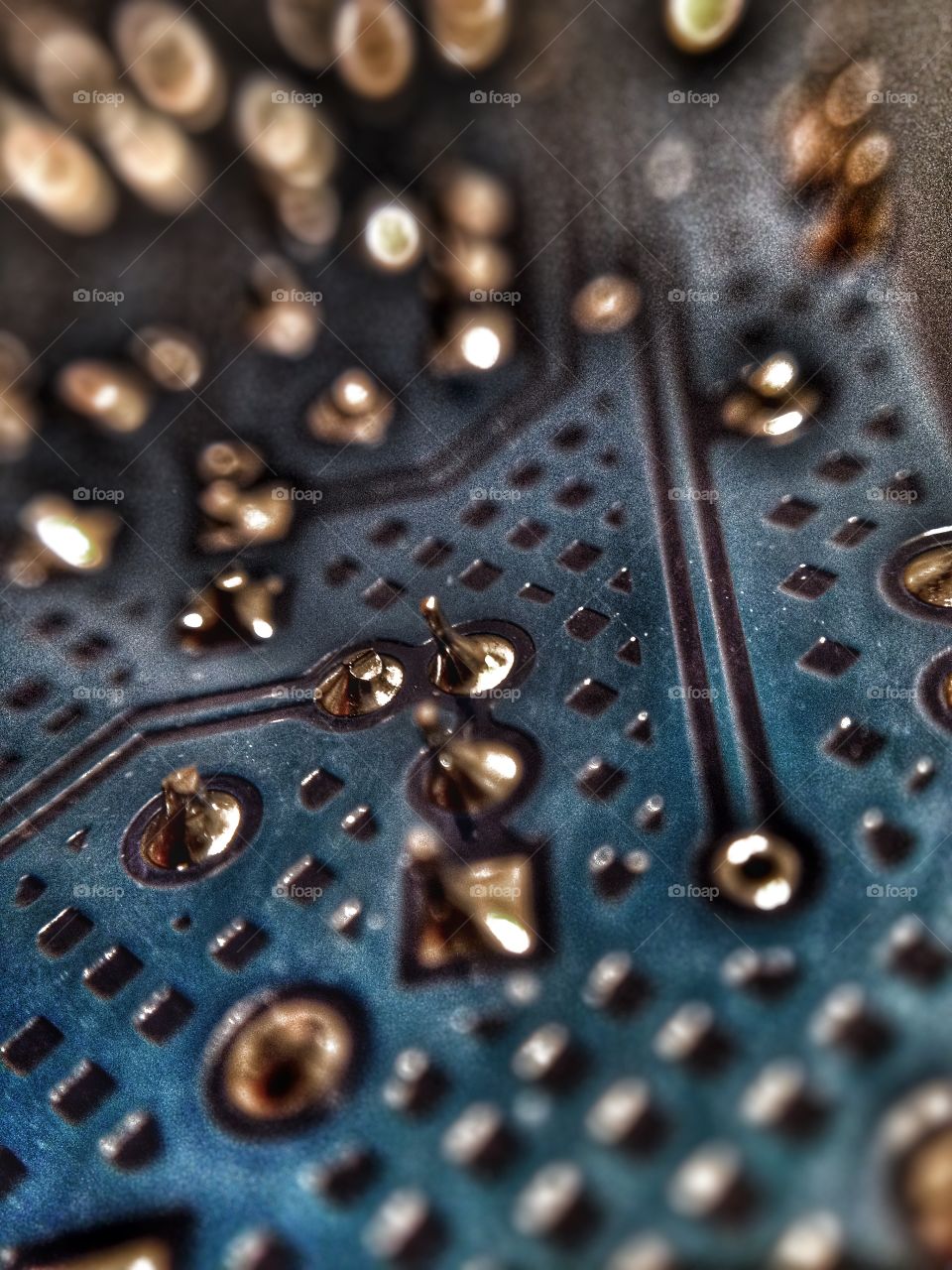 Macro shot of a blue circuit board. 