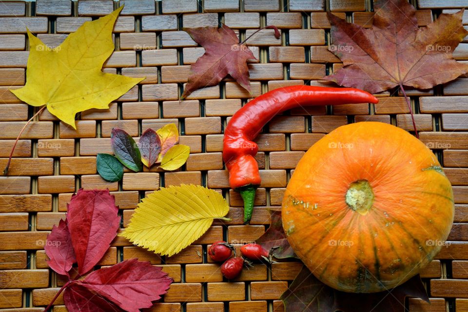 autumn composition vegetables and colours leaves on a wooden top view beautiful texture background