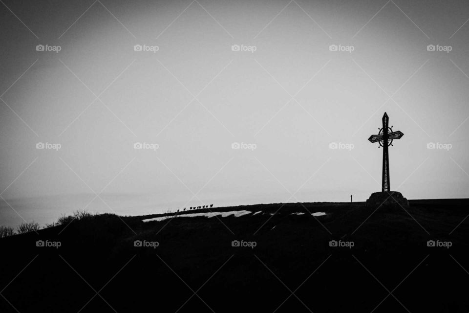 Cross on the hill. Monochrome.