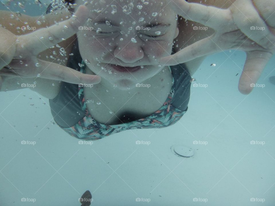 Girl swimming underwater 