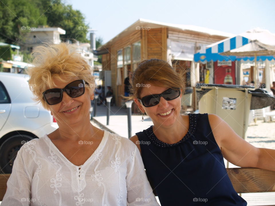 Smiling mother and daughter on the beach in Kavarna.