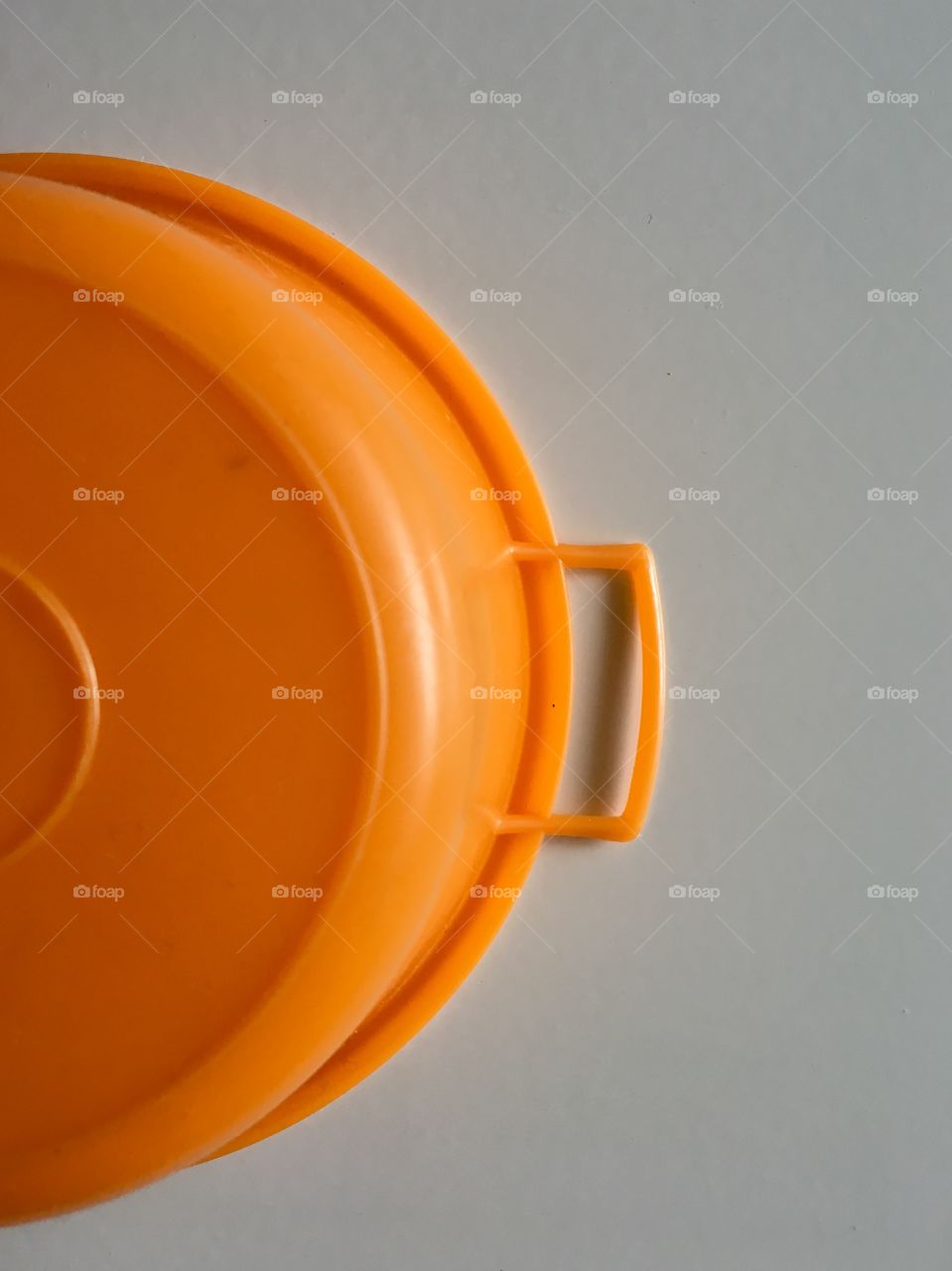 Orange container on grey background