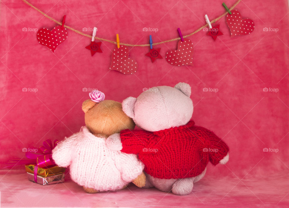 plush bears on a pink velvet background.  love concept
