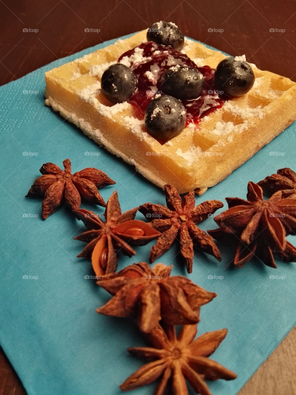 Healthy Christmas sweets with fruits, jam and dark chocolate on a rustic background