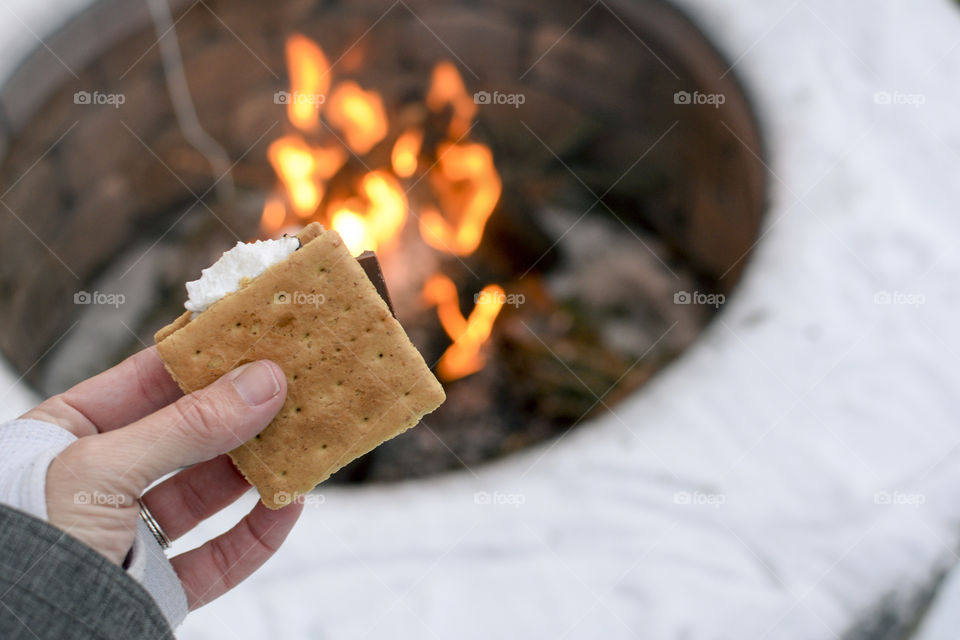 High angle view of hand holding smore