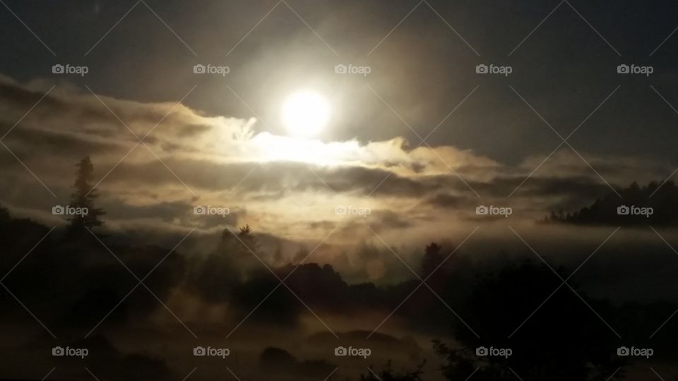 morning sun rising above clouds landscape