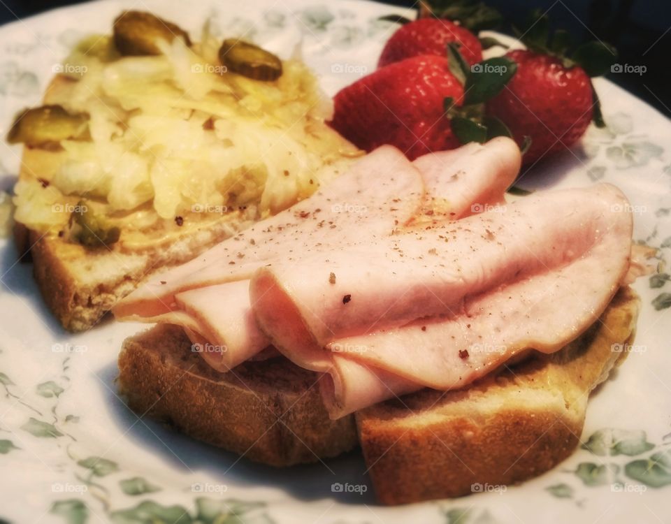 Turkey sauerkraut pickles dijon mustard on cracked wheat sour dough bread with strawberries my favorite sandwich