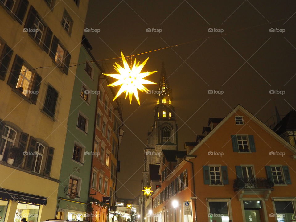 Street lightnings above in the small streets, church in the background