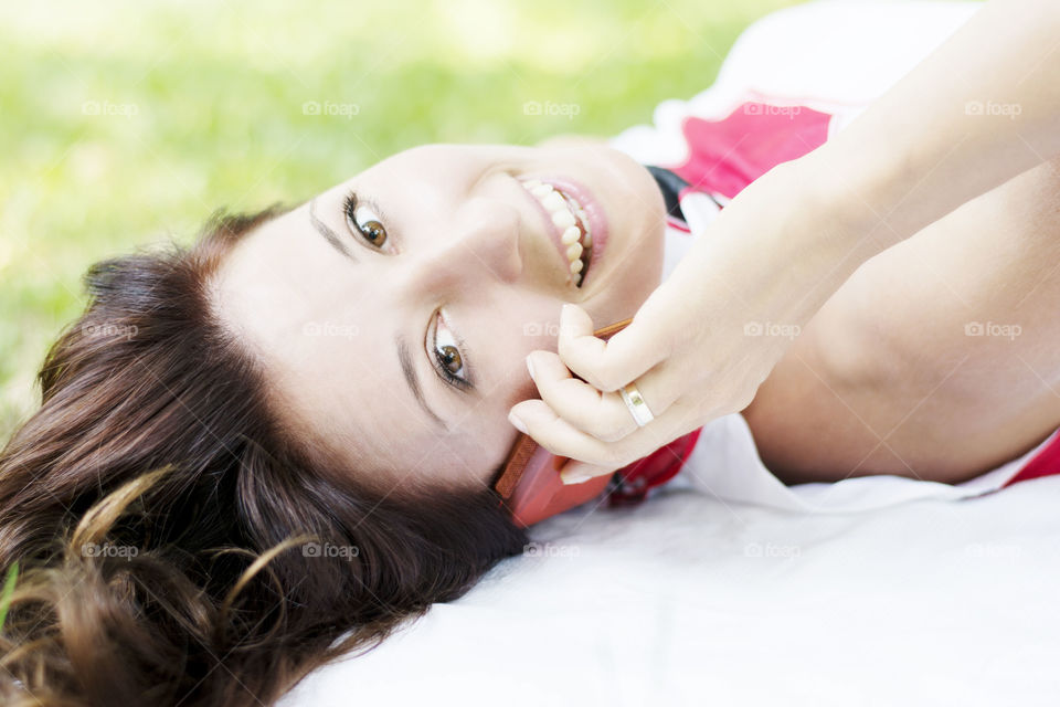 Close-up of a young woman talking on mobile phone