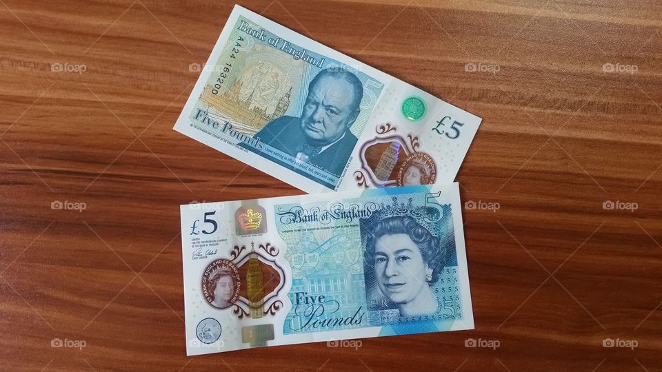 The new 5 pound notes, suitable for blog posts related to finance, money saving, budgeting, investing, insurance or related topics.