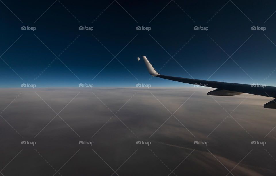 Airplane wing and moon.