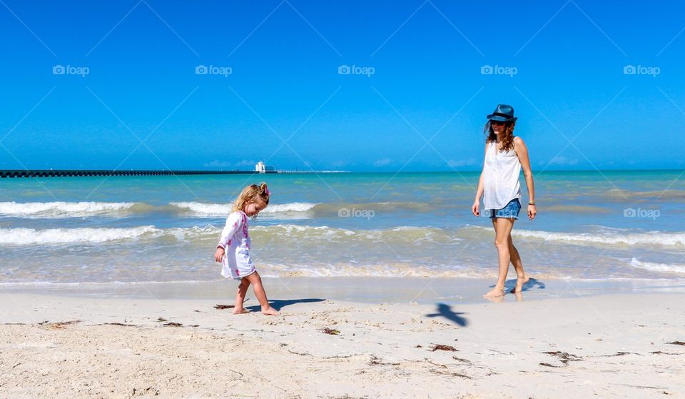 Mom child fun at the beach