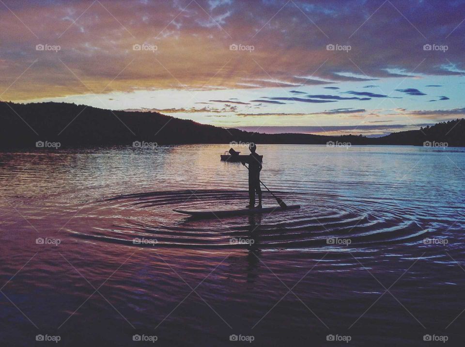 Sunset reflecting onto dark waters