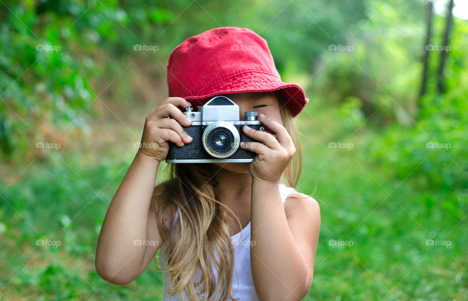A cute girl capturing photo