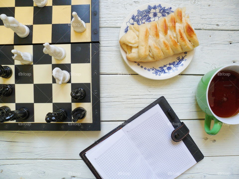 chess, apple pie, a cup of tea and a notebook