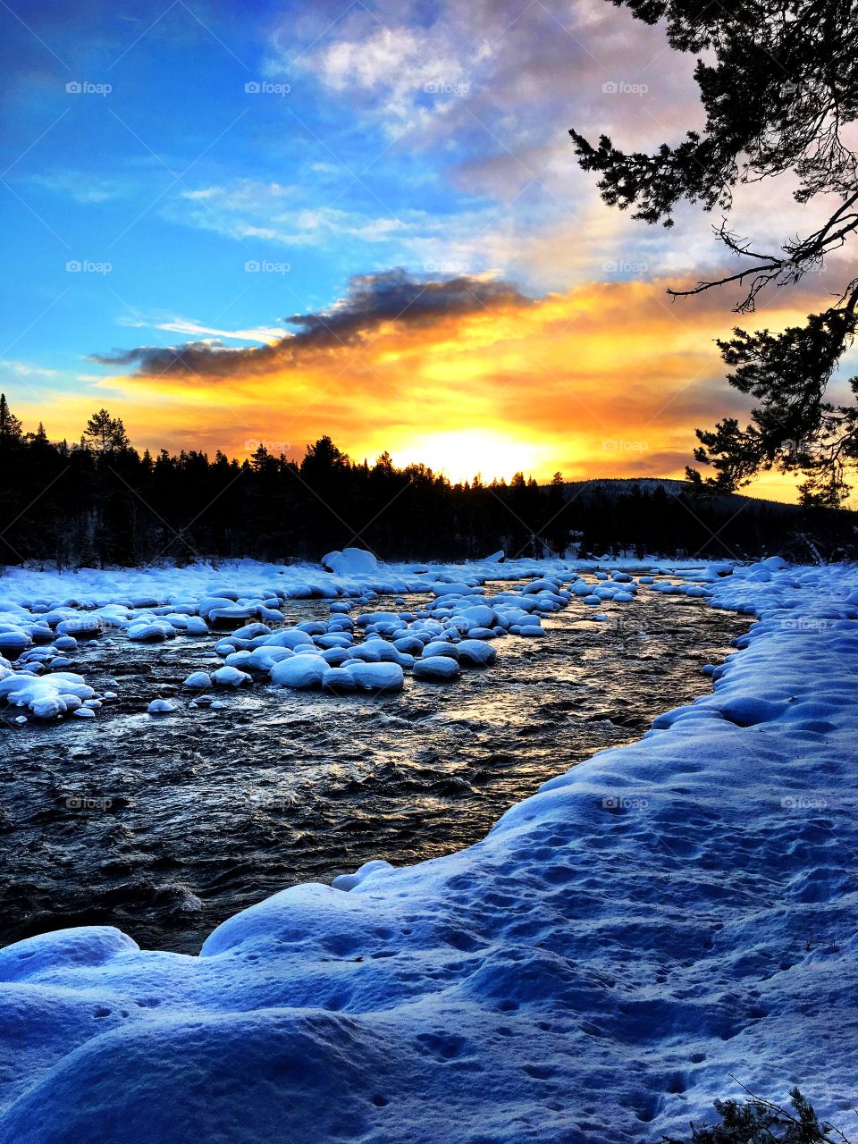 Frozen river during sunset