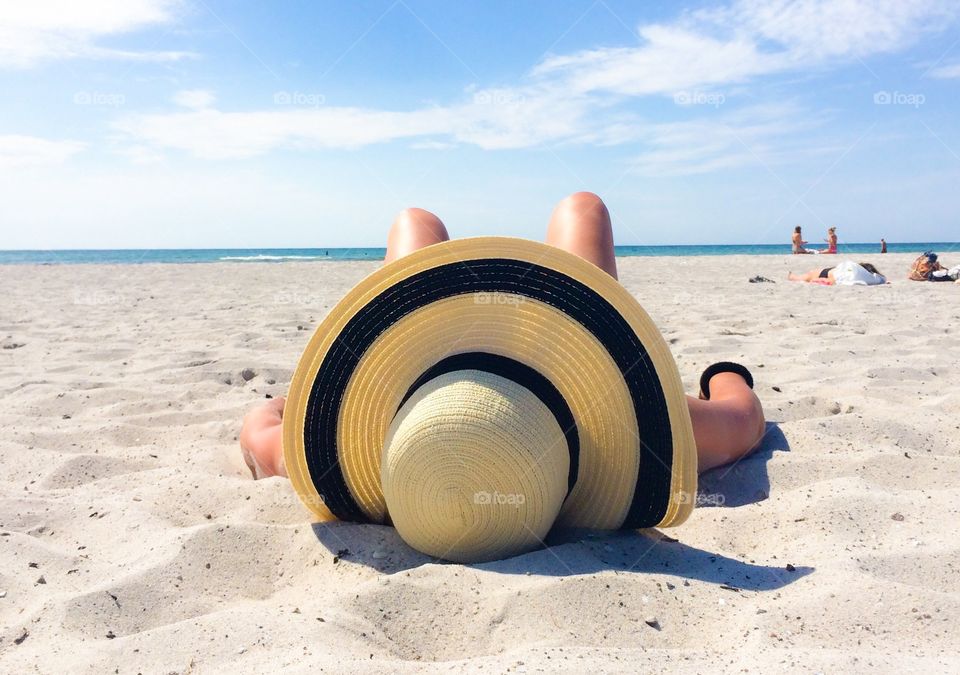 Person relaxing on beach