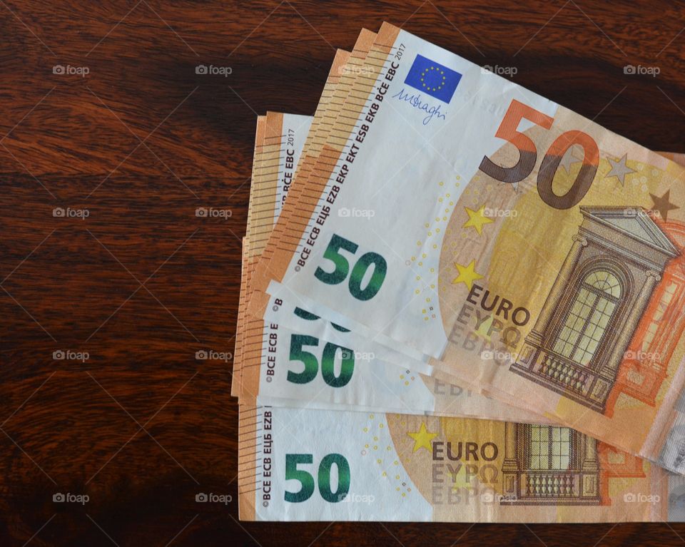 50 Euro note on wood table