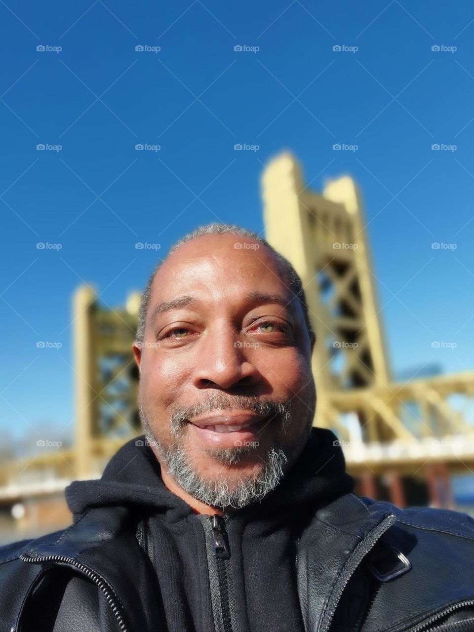 self-portrait in downtown Sacramento at the Golden Bridge