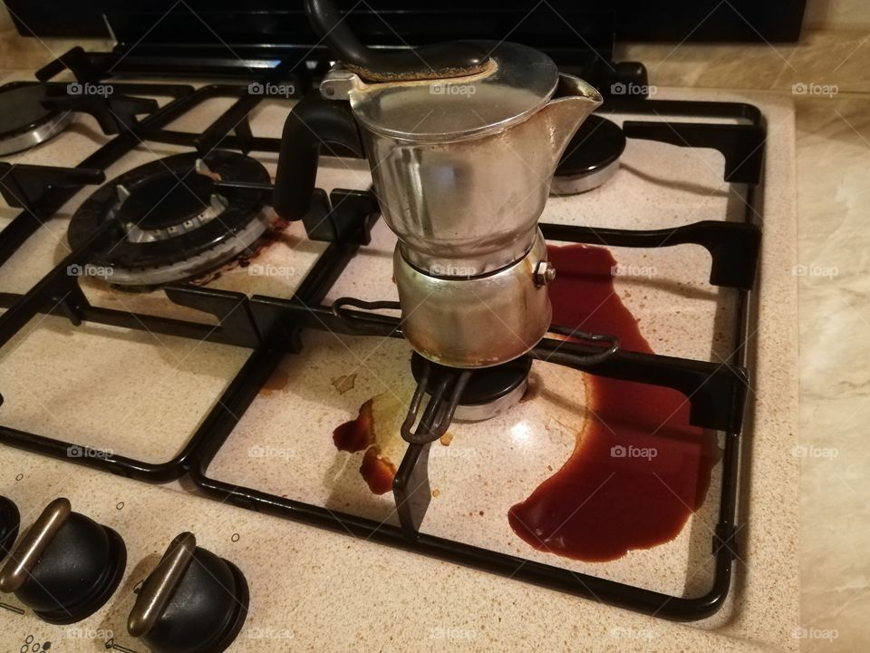 Dirty hob of coffee and coffee maker