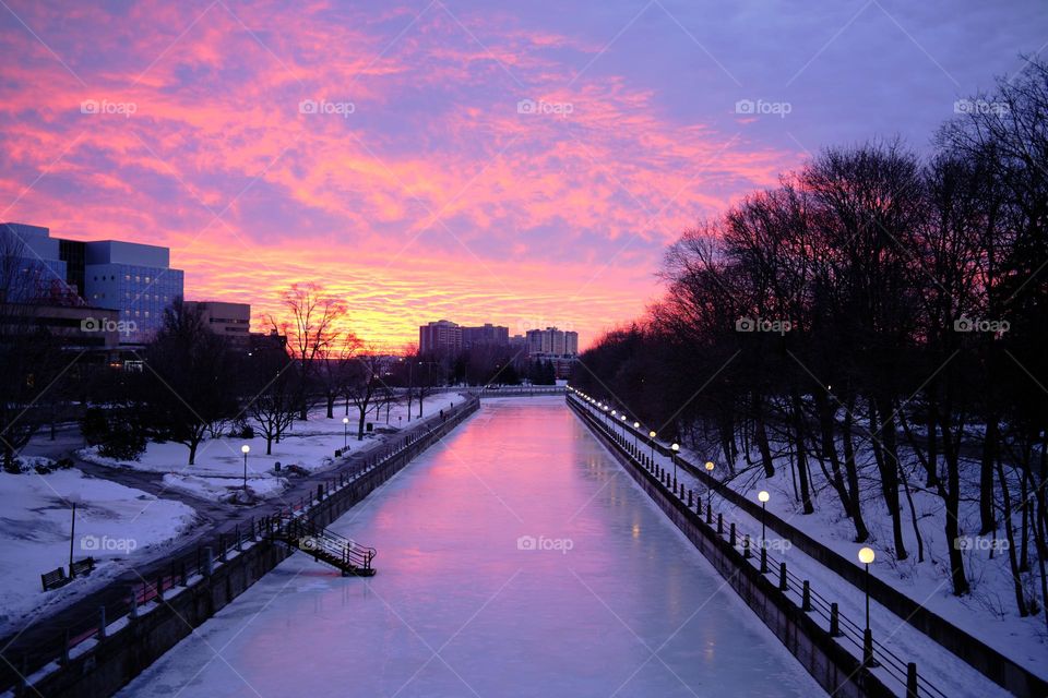 Sunrise and colour reflection on the frozen Rideau Canal - the longest skating rink