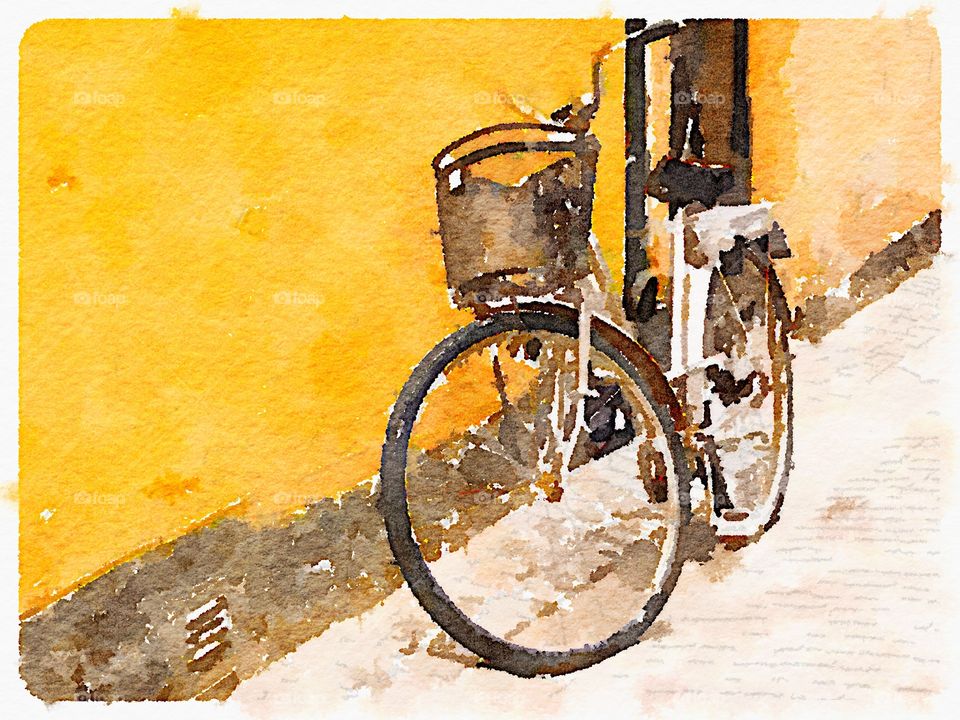 Bicycle against a yellow wall in Sweden . Bicycle in Gamla Stan, Stockholm 