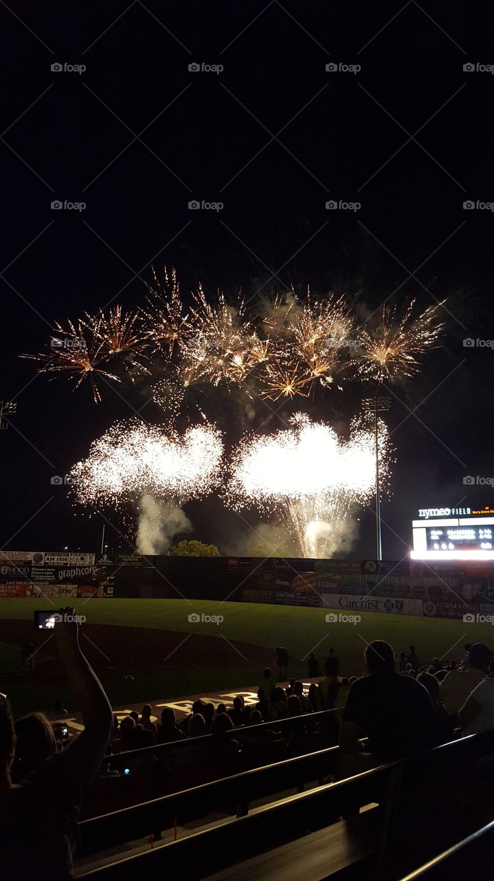 Sizzling fireworks. Colorful fireworks sizzle in the night sky following a Frederick Keys baseball game, in historic downtown Frederick, Mar