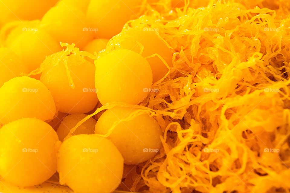 Thai Dessert 
Egg Yoke Fudge Balls Cooked in Syrup
Golden threads