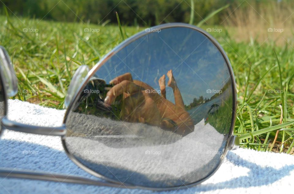 reflection female legs barefoot view from the ground