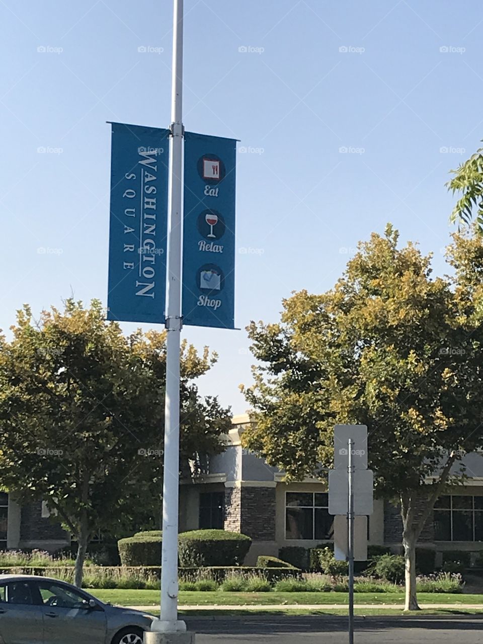Shopping center signs. They represent Washington Square, a shopping center located in an upscale part of the city. Visitors can enjoy themselves there.