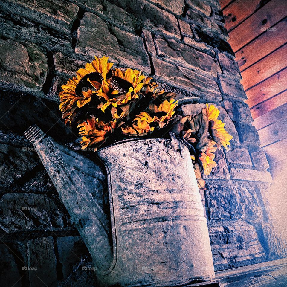Beautiful flowers hanging over a fireplace in the north Georgia Appalachian mountains
