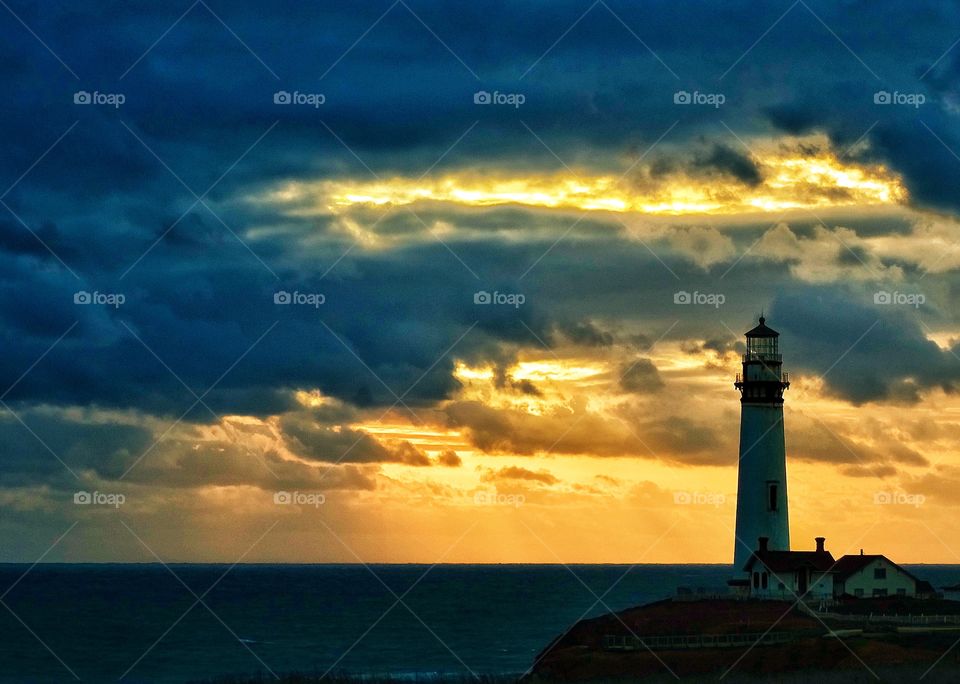 Lighthouse At Sunset. California Lighthouse During The Golden Hour
