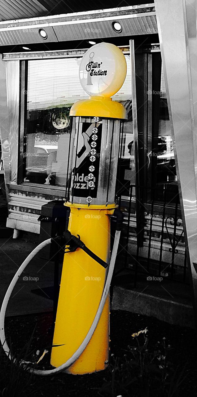 Fillin' Station. Antique gas pump - yellow mission