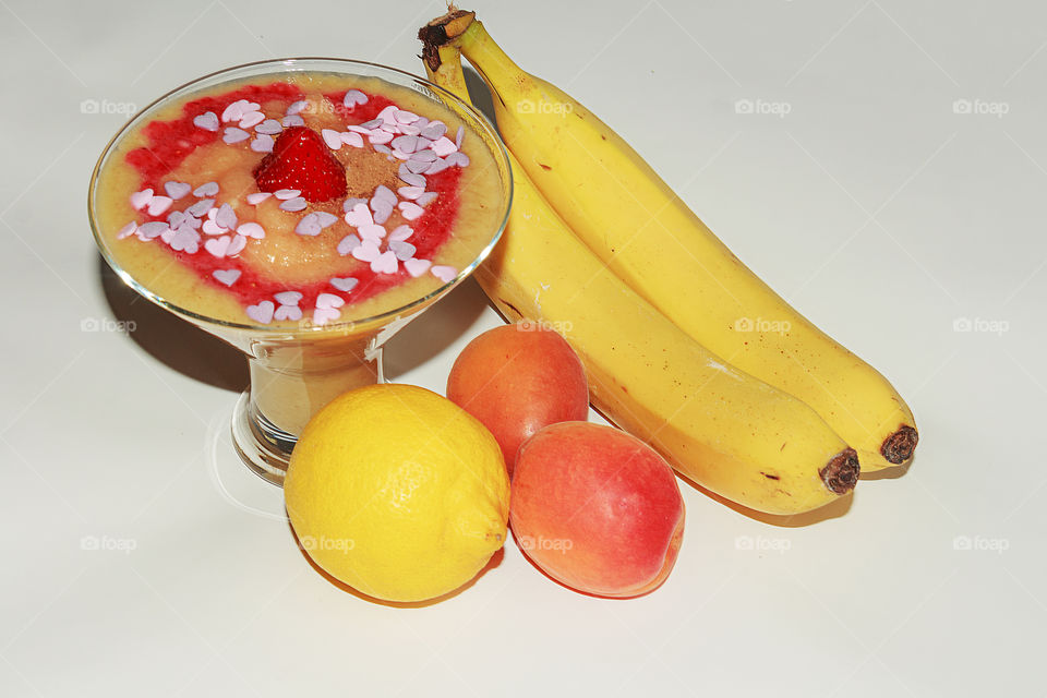 Delicious dessert made from fruits, bananas, apricots, apples and strawberry