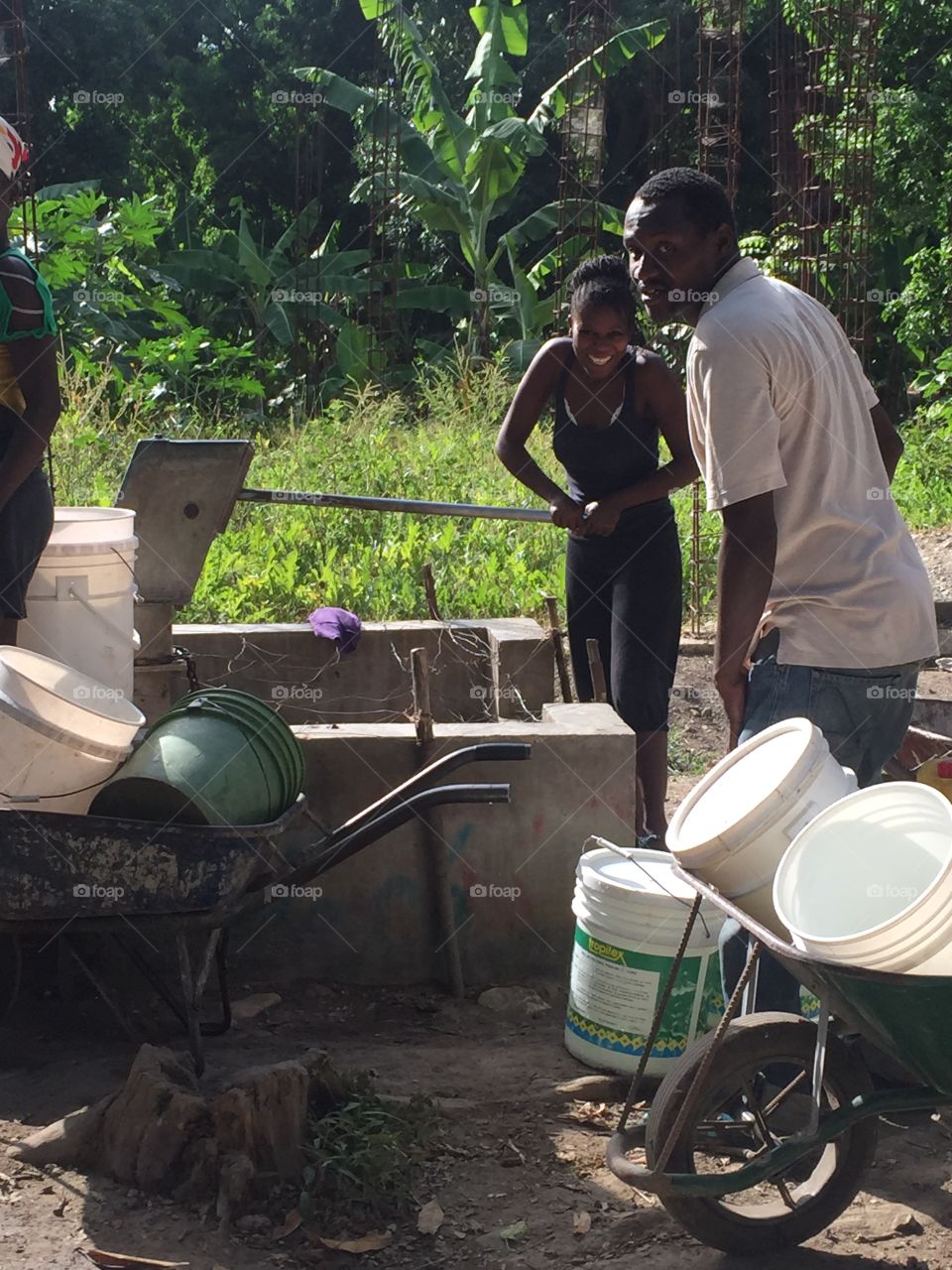 Retrieving water in Haiti
