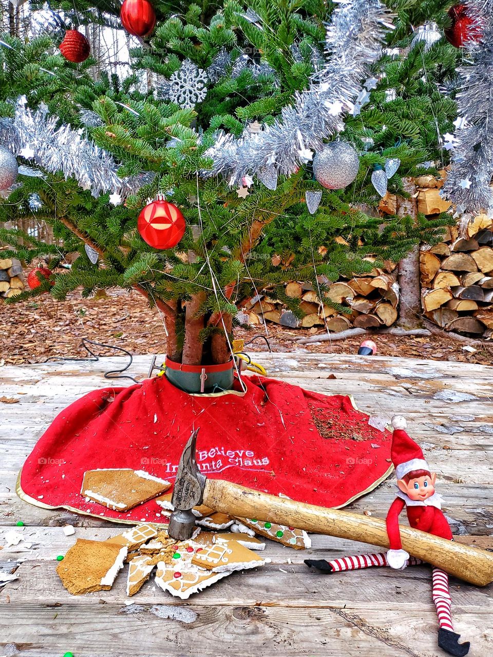 Elf on the shelf destroys gingerbread house.