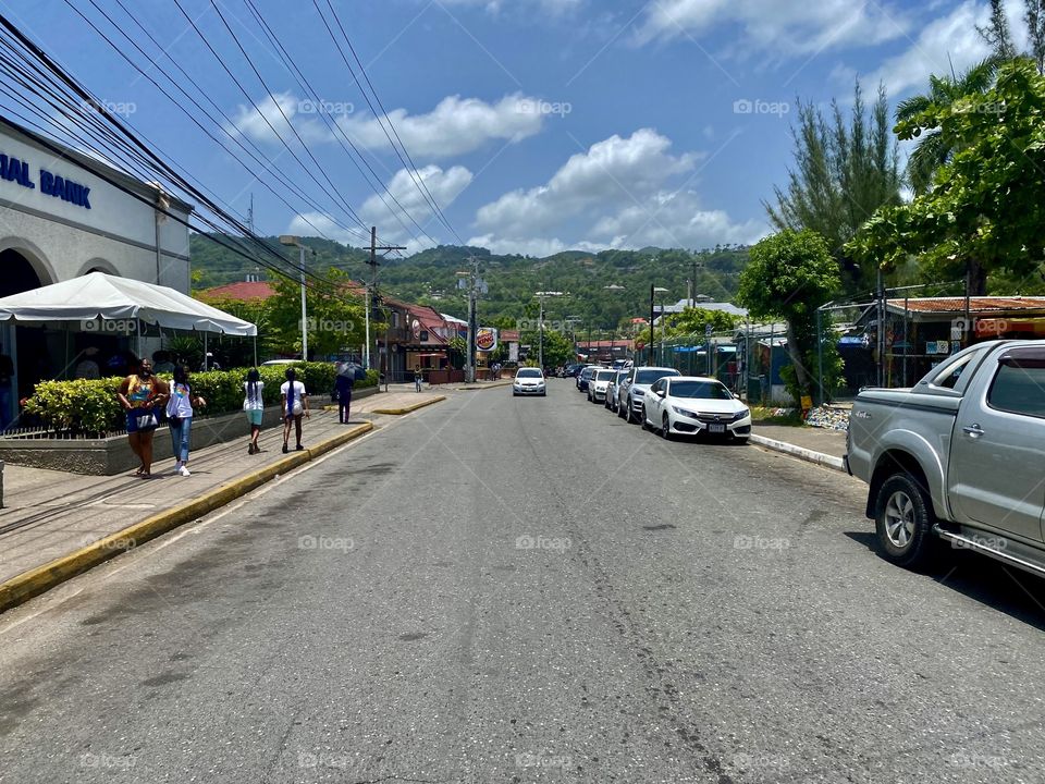 Walking across Main Street in Ocho Rios Jamaica 