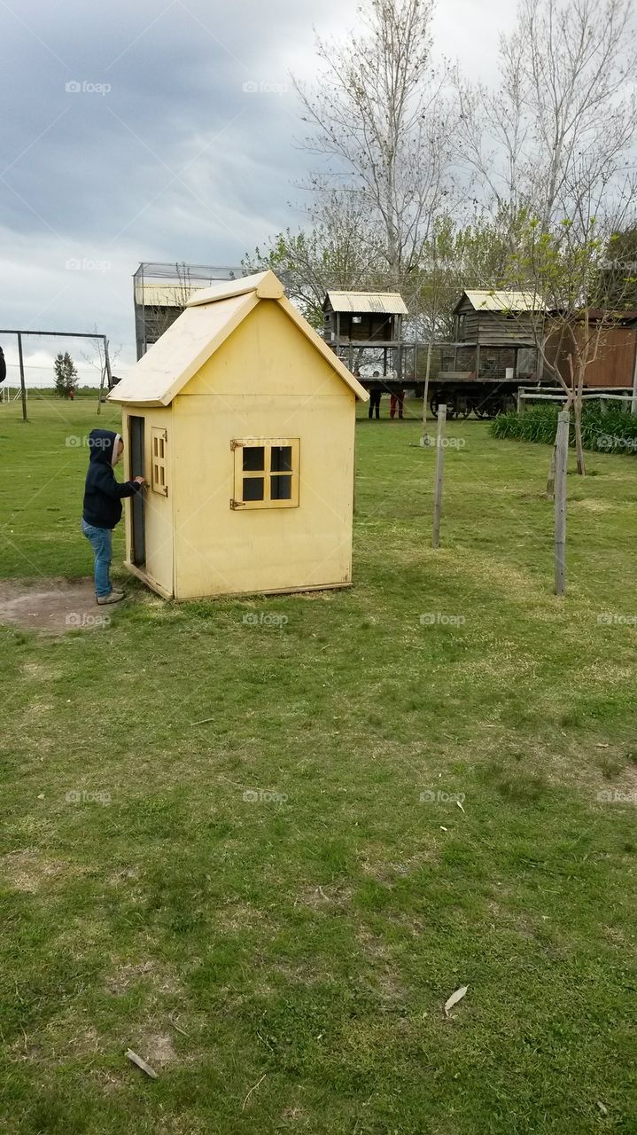 Boy in a playhouse