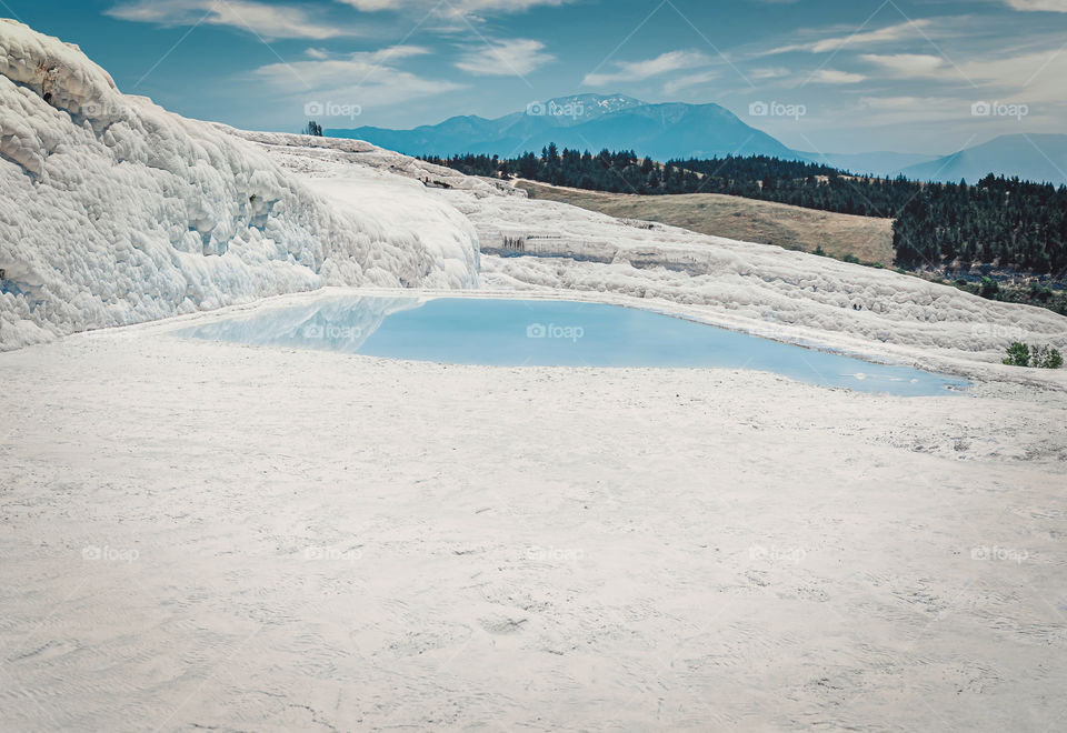 Blue lagoon in Travertines of Pamukkale. Turkey.