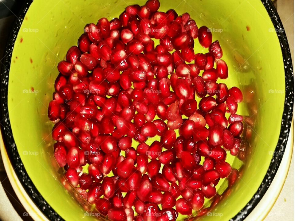 a bowl of pomegranate seeds