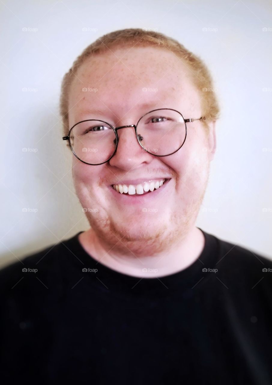 Man wearing Glasses & Smiling