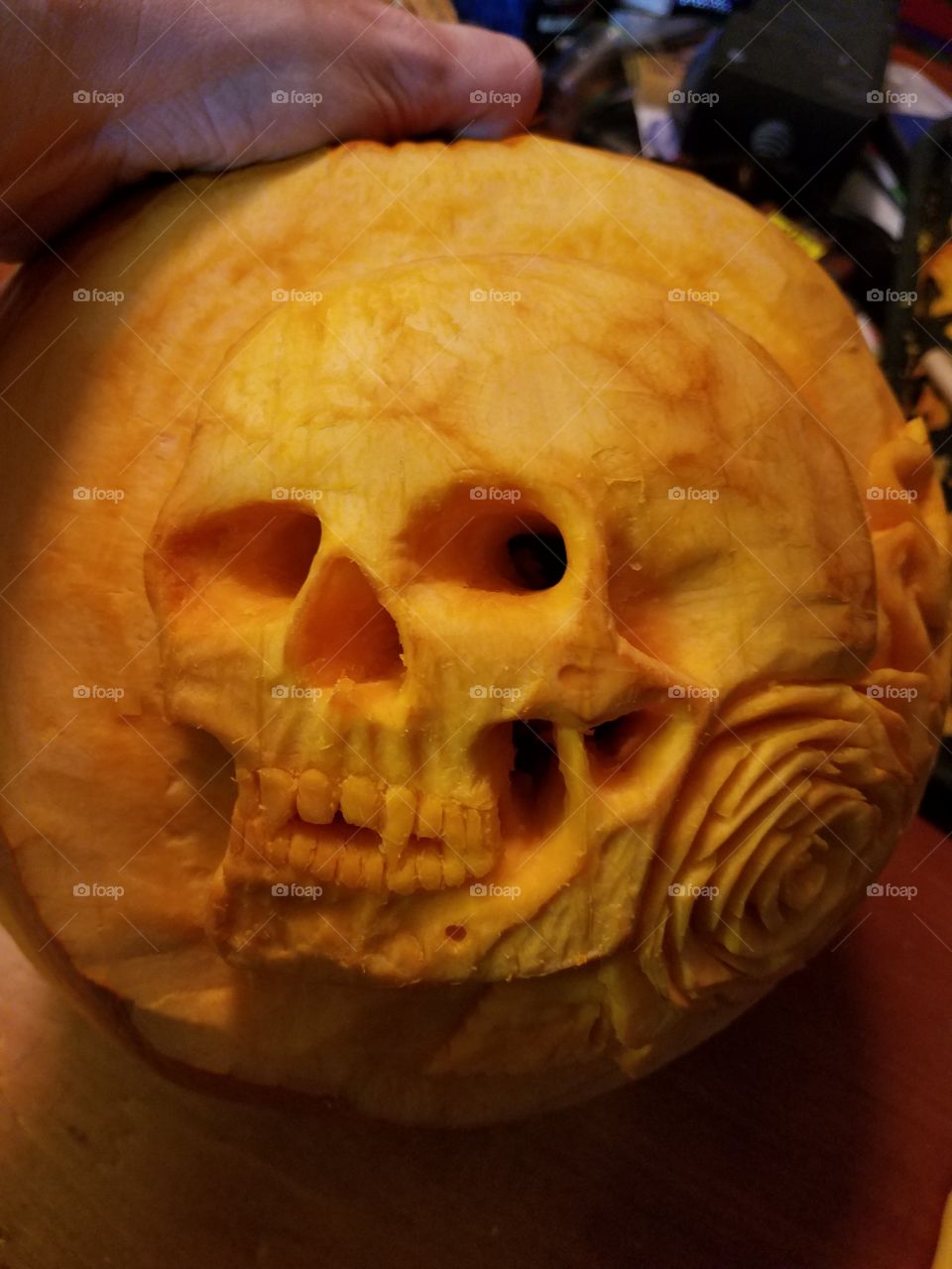 Picture of the skull pumpkin carving looking straight at the face of the pumpkin. Was creating depth so when the candlelight illuminated from within, there would be awesome results.