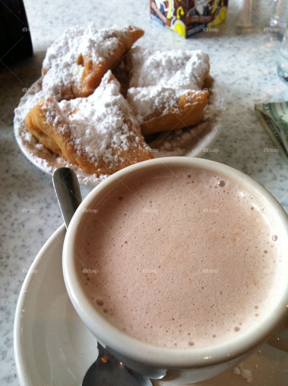 Eating beignets at Cafe du Monde in New Orleans Louisiana. 