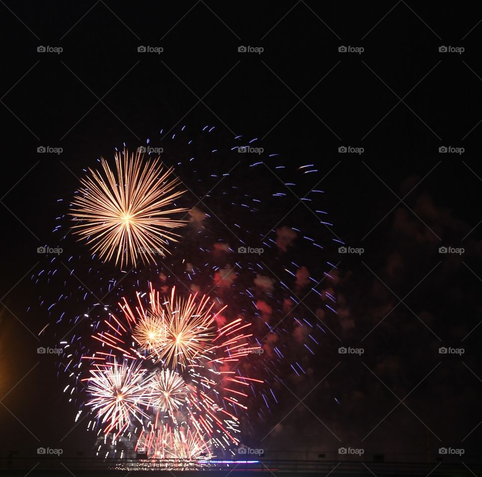 Fireworks display against sky