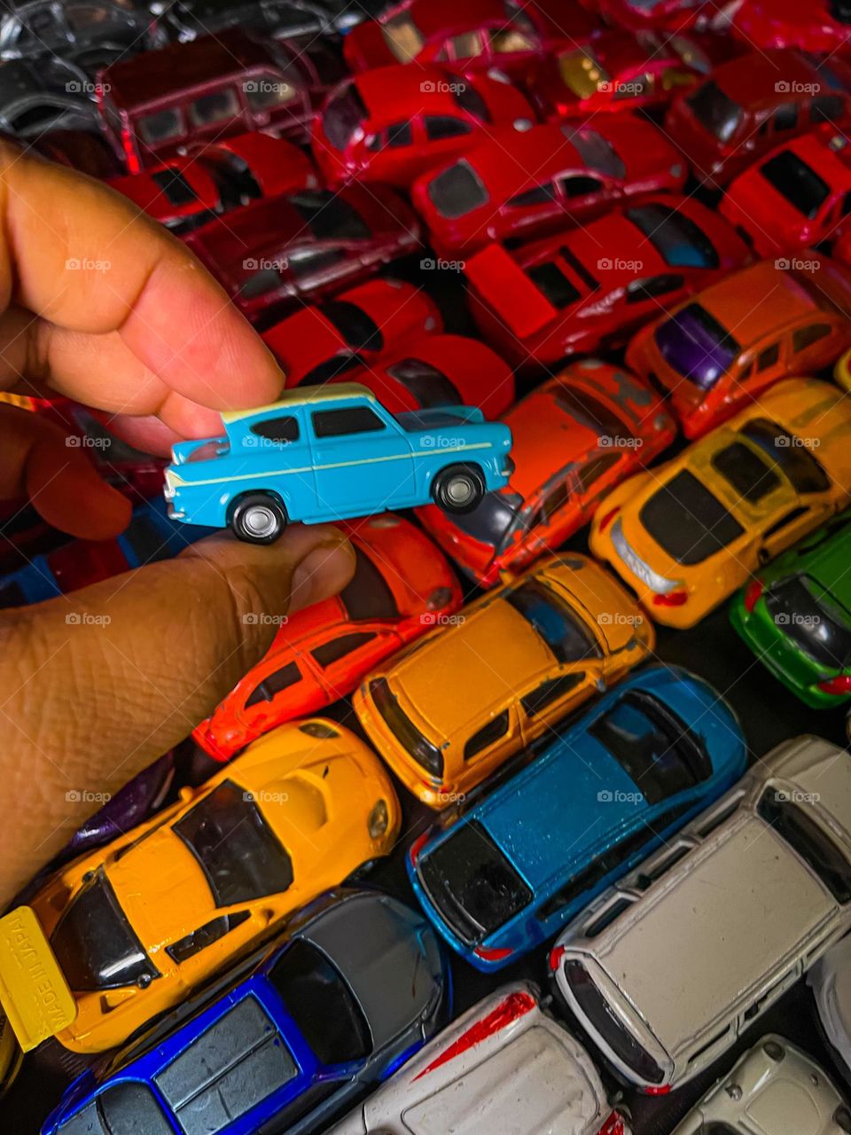 Colourful mini toy cars in colour coding in close up view