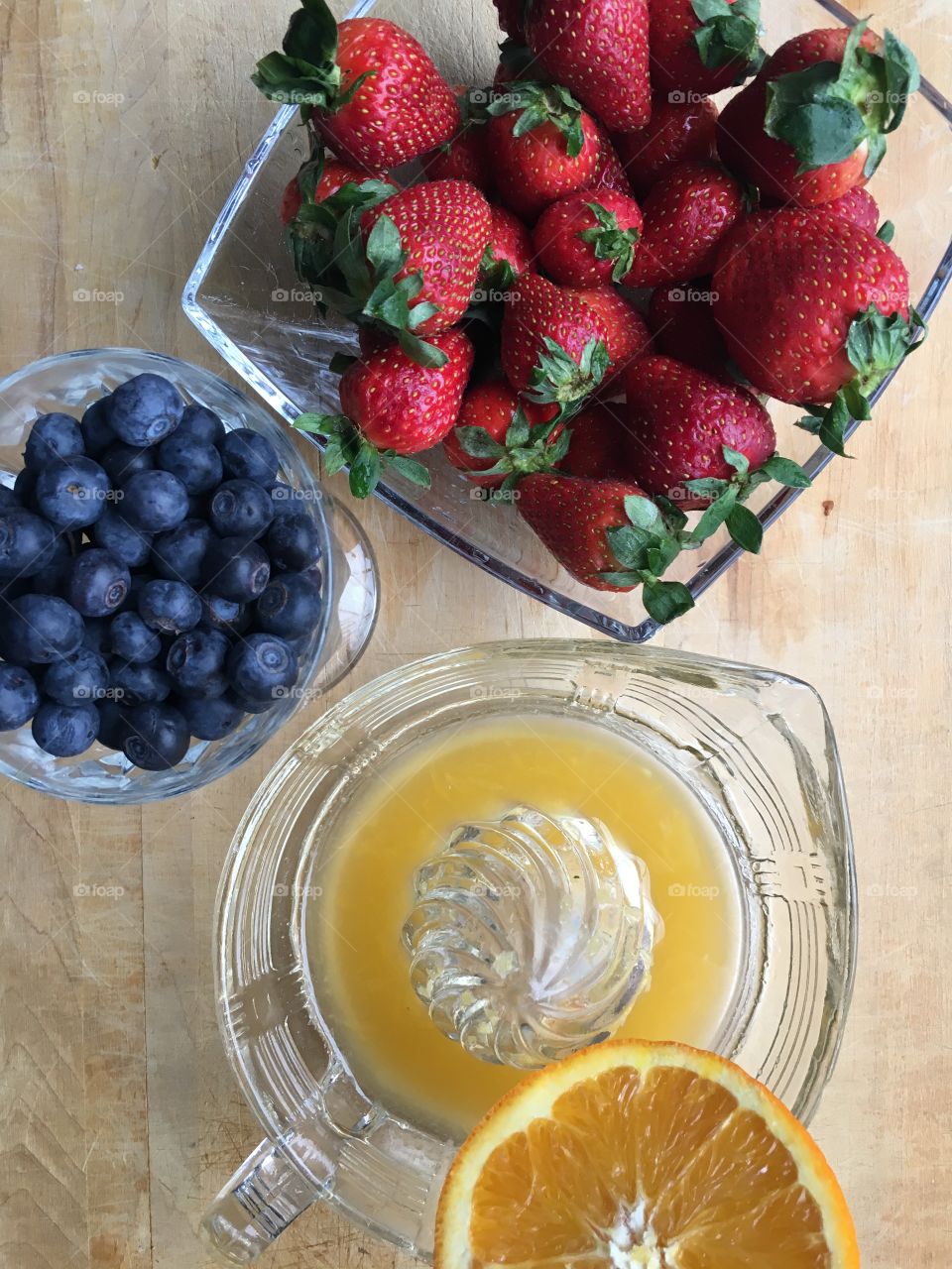 Healthy breakfast, fresh berries and freshly squeezed orange