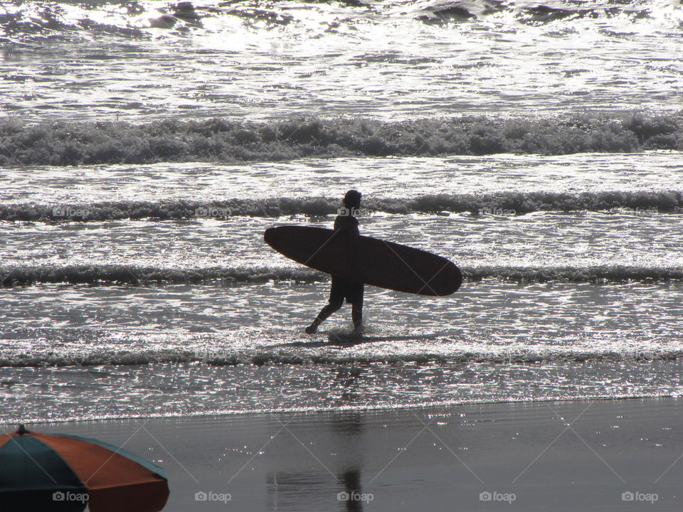 beach silhouette waves surfer by dmelhorn