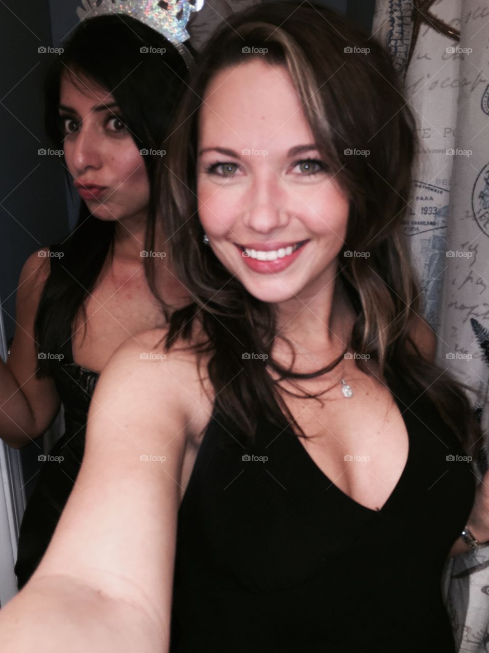 Gorgeous young girl with friend taking selfie