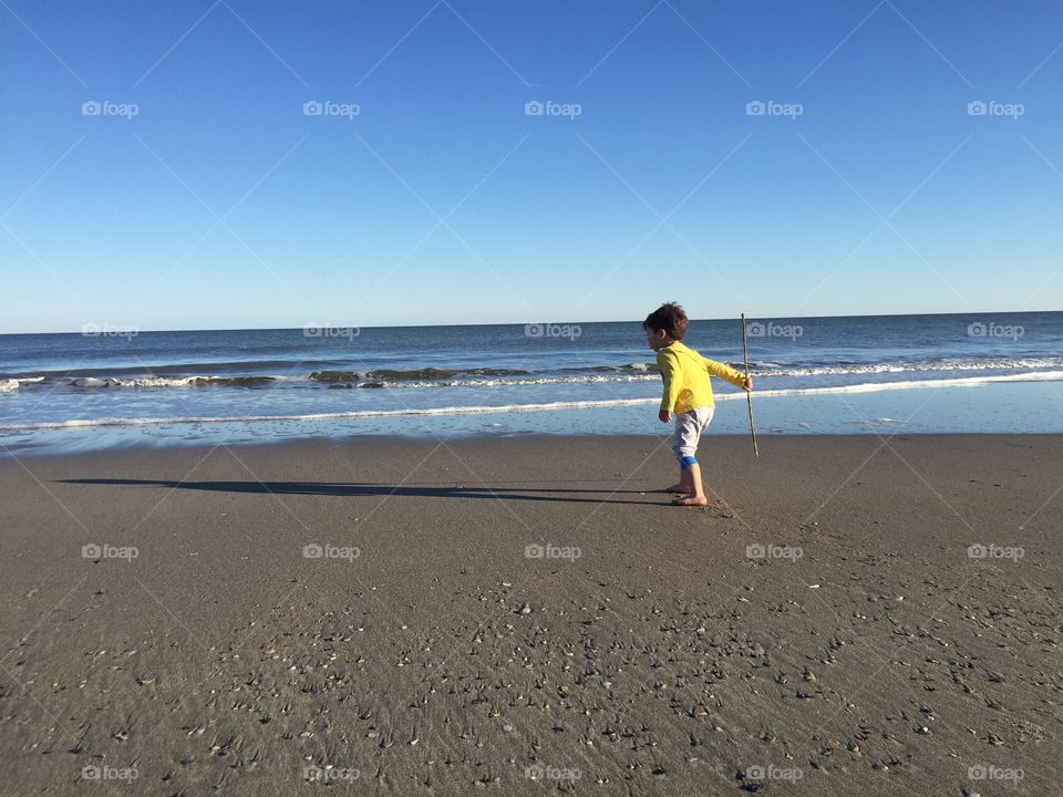 Boy Playing on the Beach